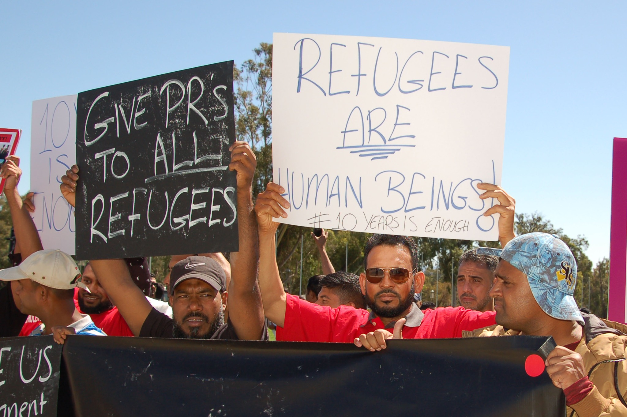 Refugees welcome banners fly in front of Sydney Town Hall